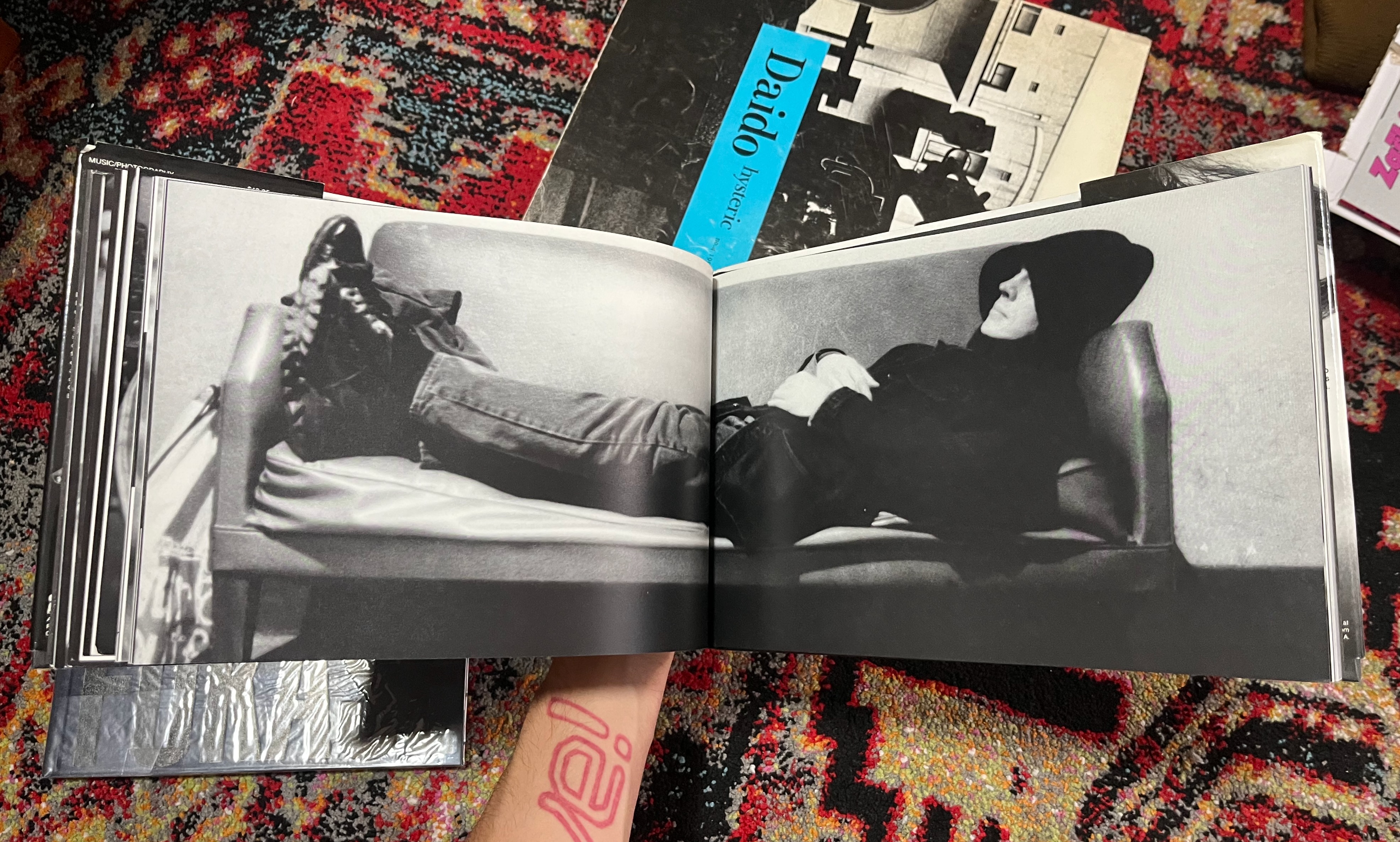 photobook spread of a man laying on the couch